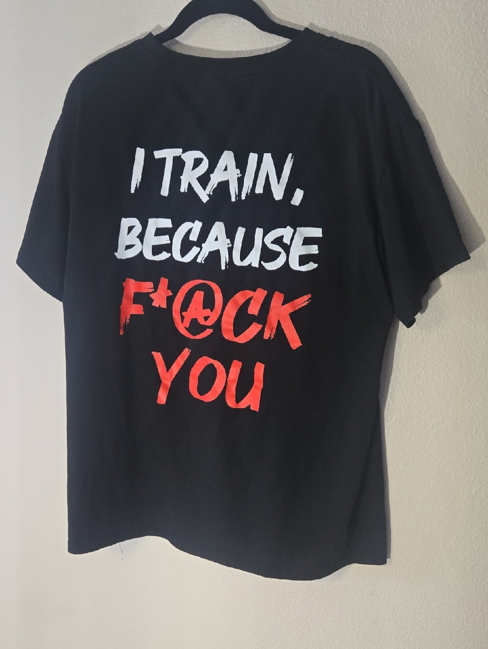 Chicy Ea Black Short Sleeve Graphic Tee with Bold White & Red Text